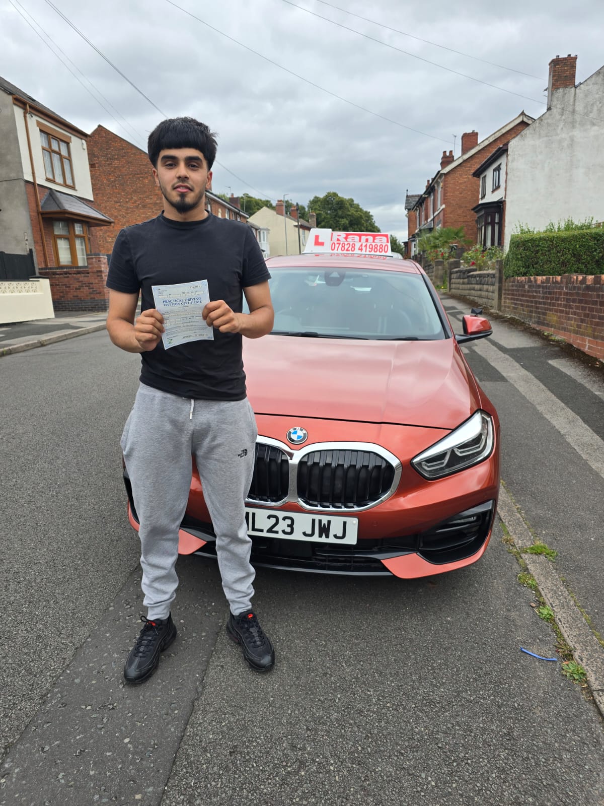 Successful student with driving pass certificate